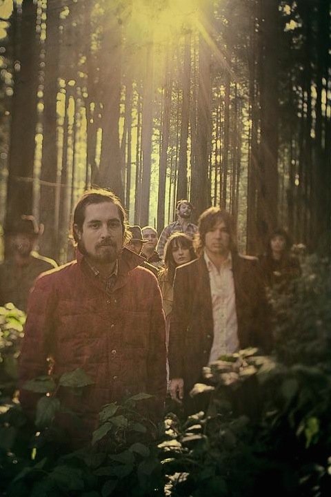 Lonesome Rhodes and the Good Company band members in the woods.