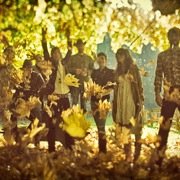 Lonesome Rhodes and the Good Company band members outside throwing leaves.